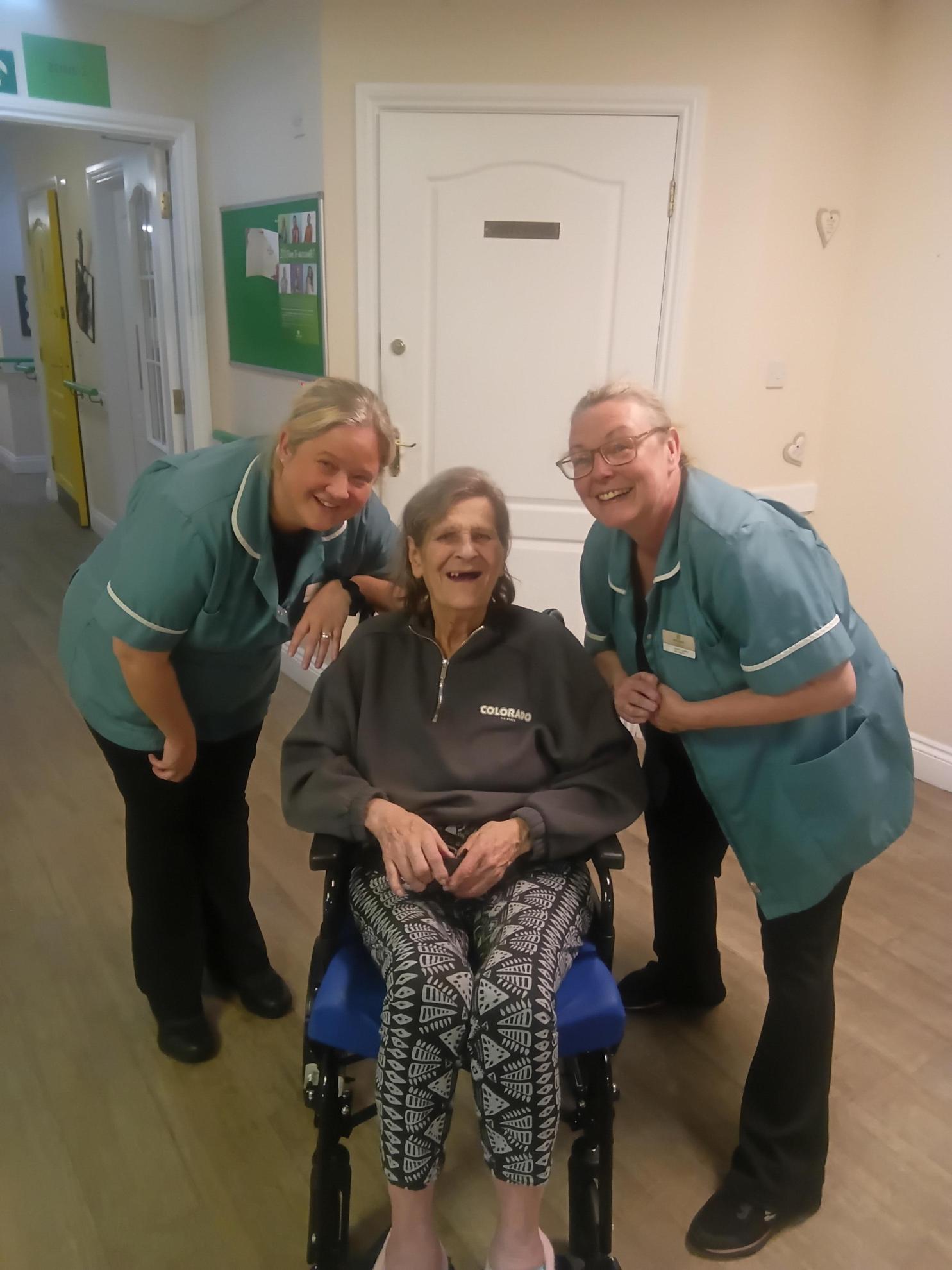 Photo of 3 people together smiling