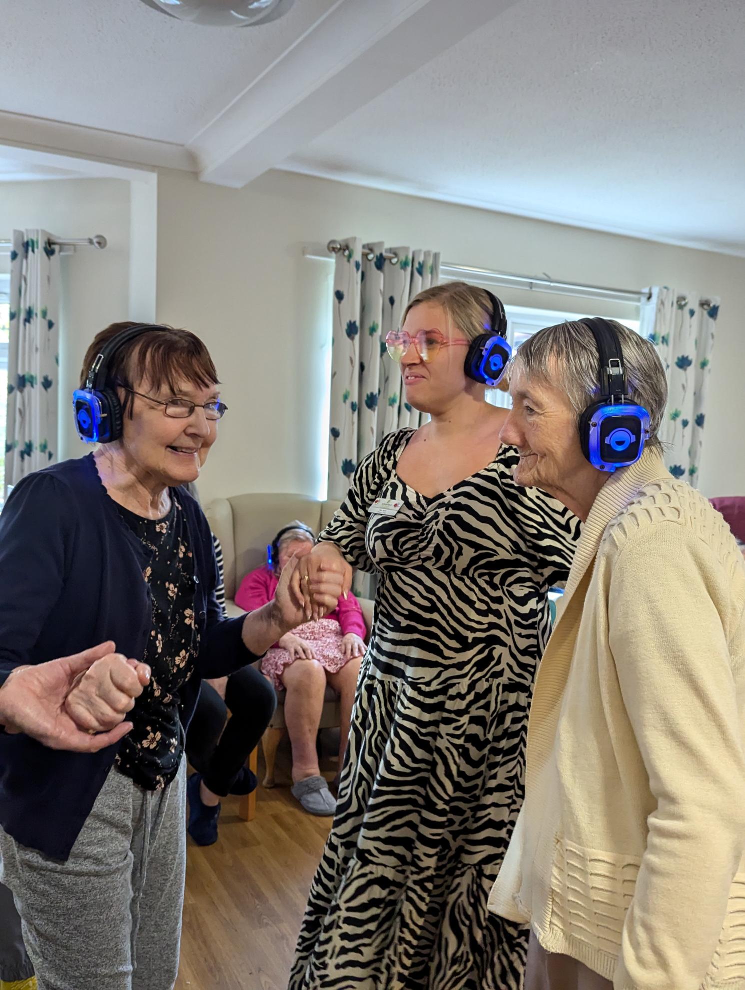 Residents enjoying Silent Disco at Castleford Lodge Care Home in West Yorkshire