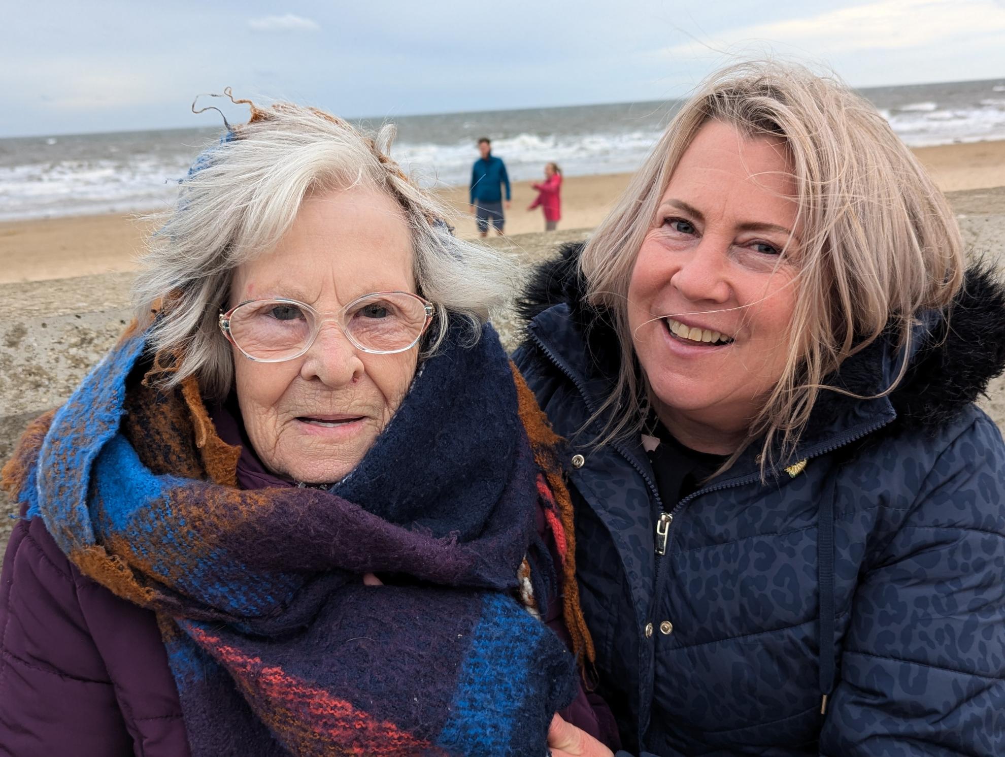 Smiling ladies by the beach front