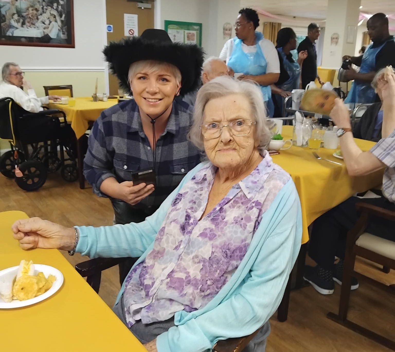 Photo of residents and families at Chatsworth in cowboy hats