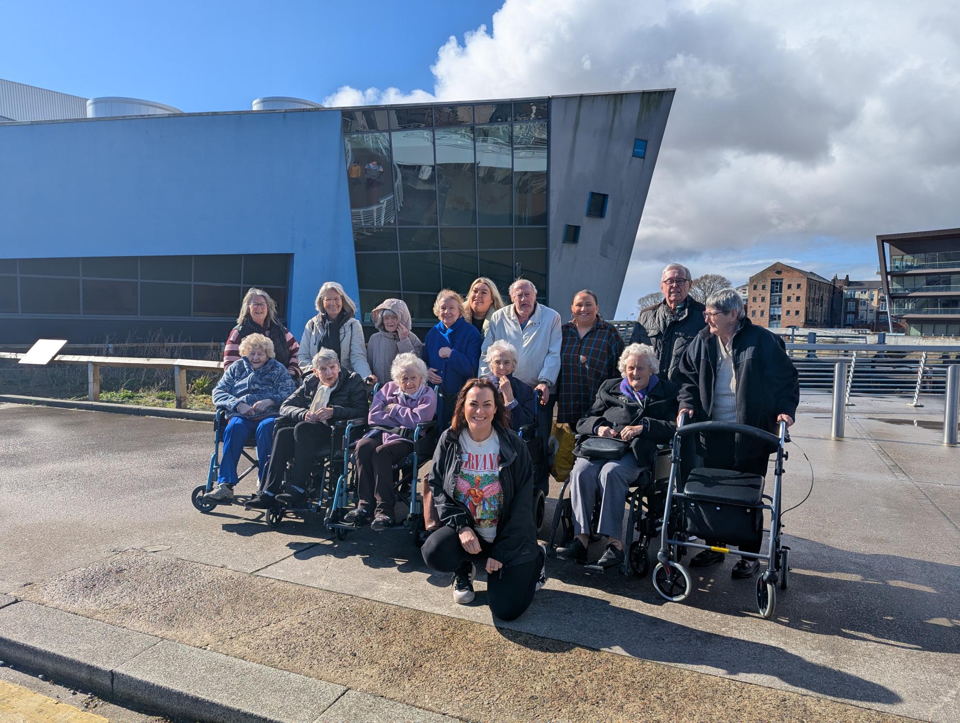 Group photo outside of the deep in hull