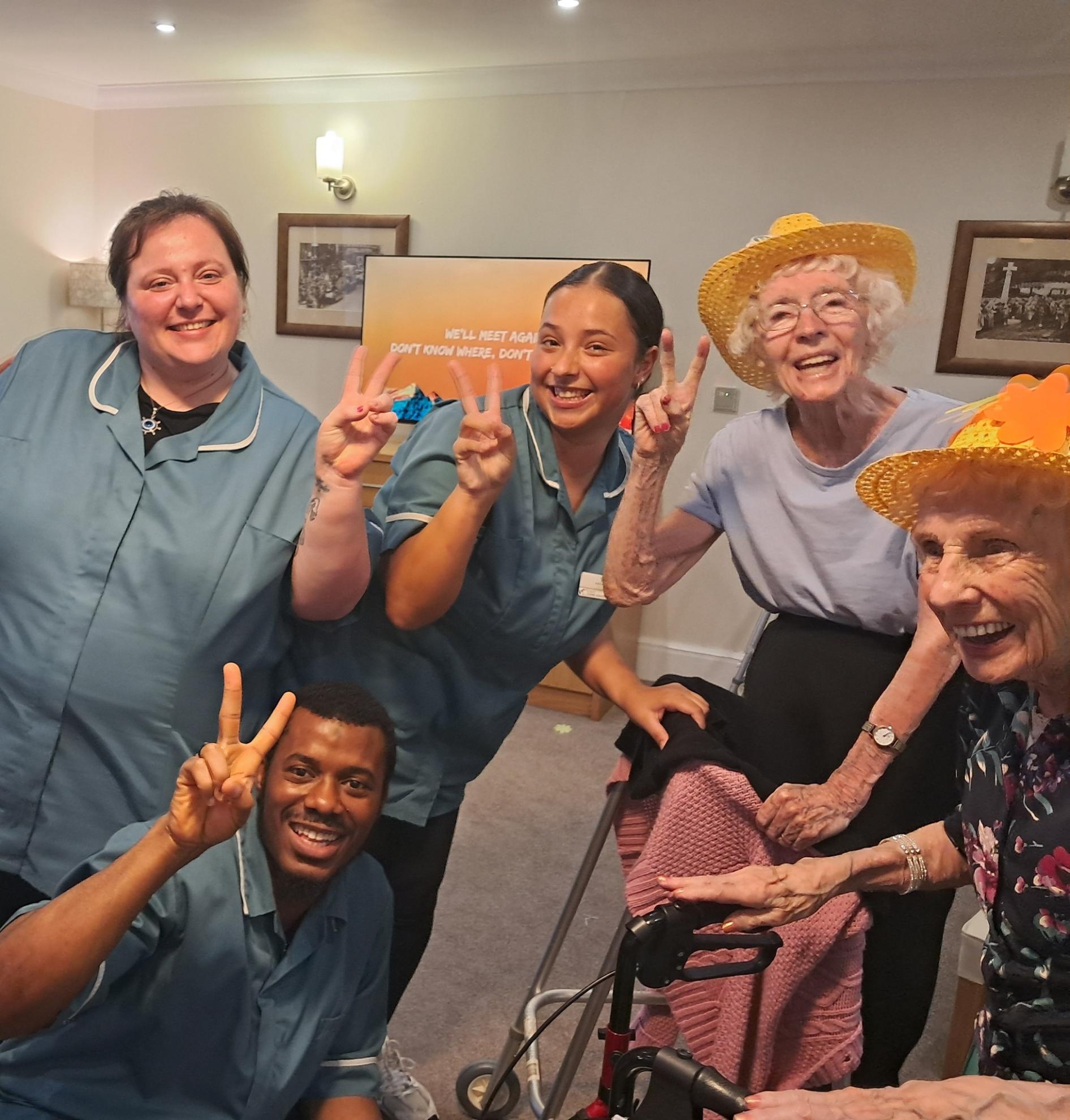 group of people doing the peace sign
