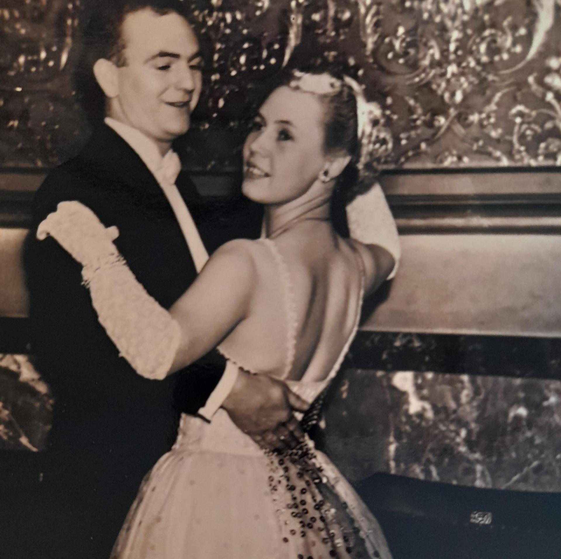 Couple ballroom dancing in 1940s