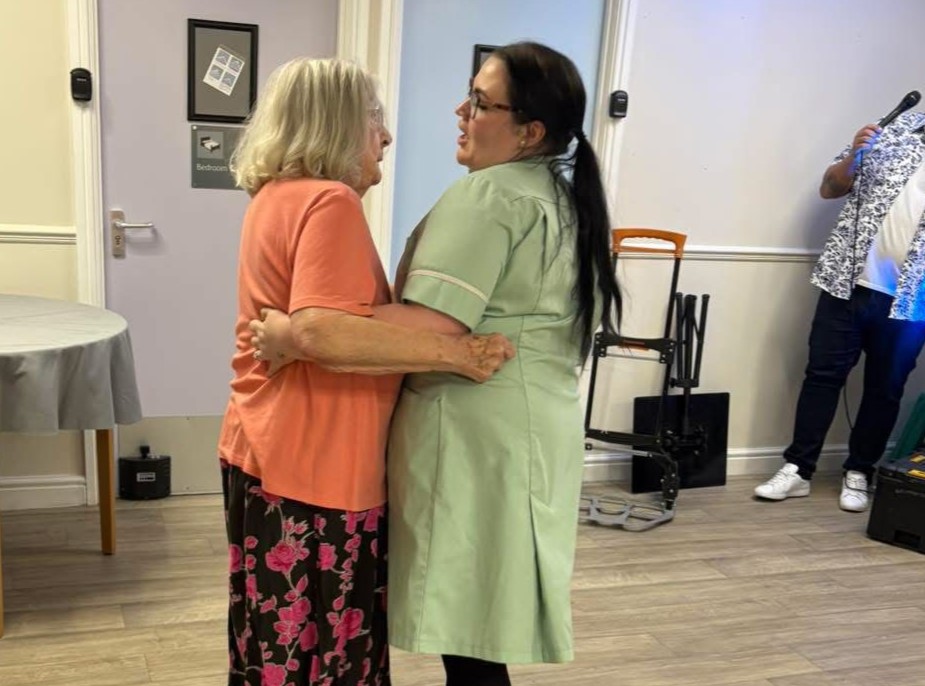 Kayleigh and resident having a dance together