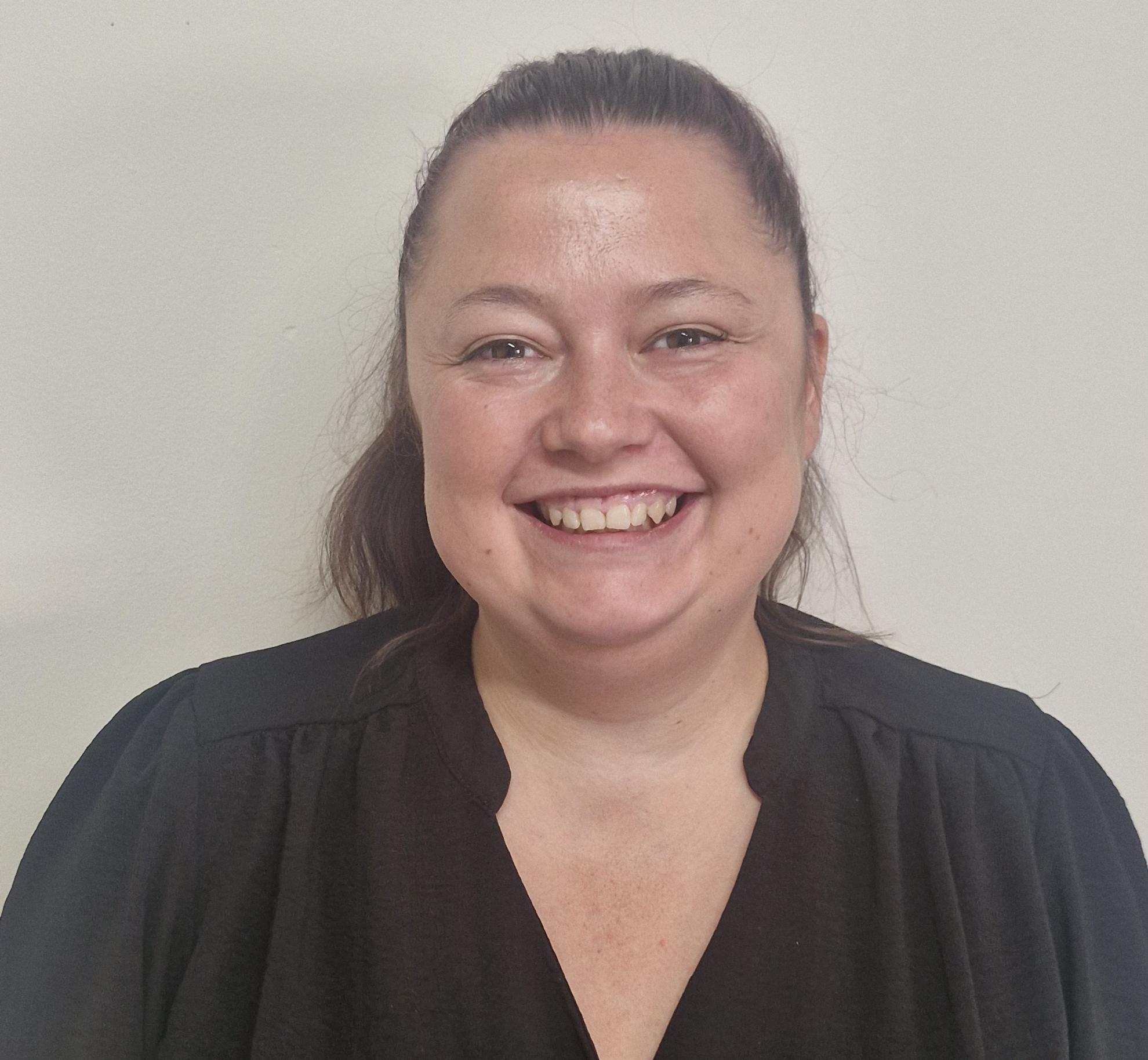 Smiling headshot of Lisa-Marie