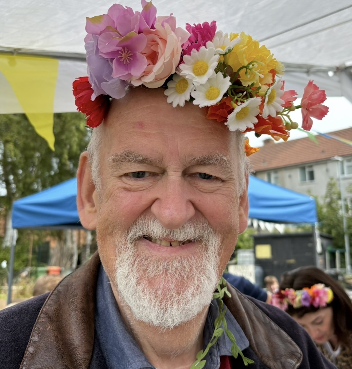 Michael smiling with flower crown on head