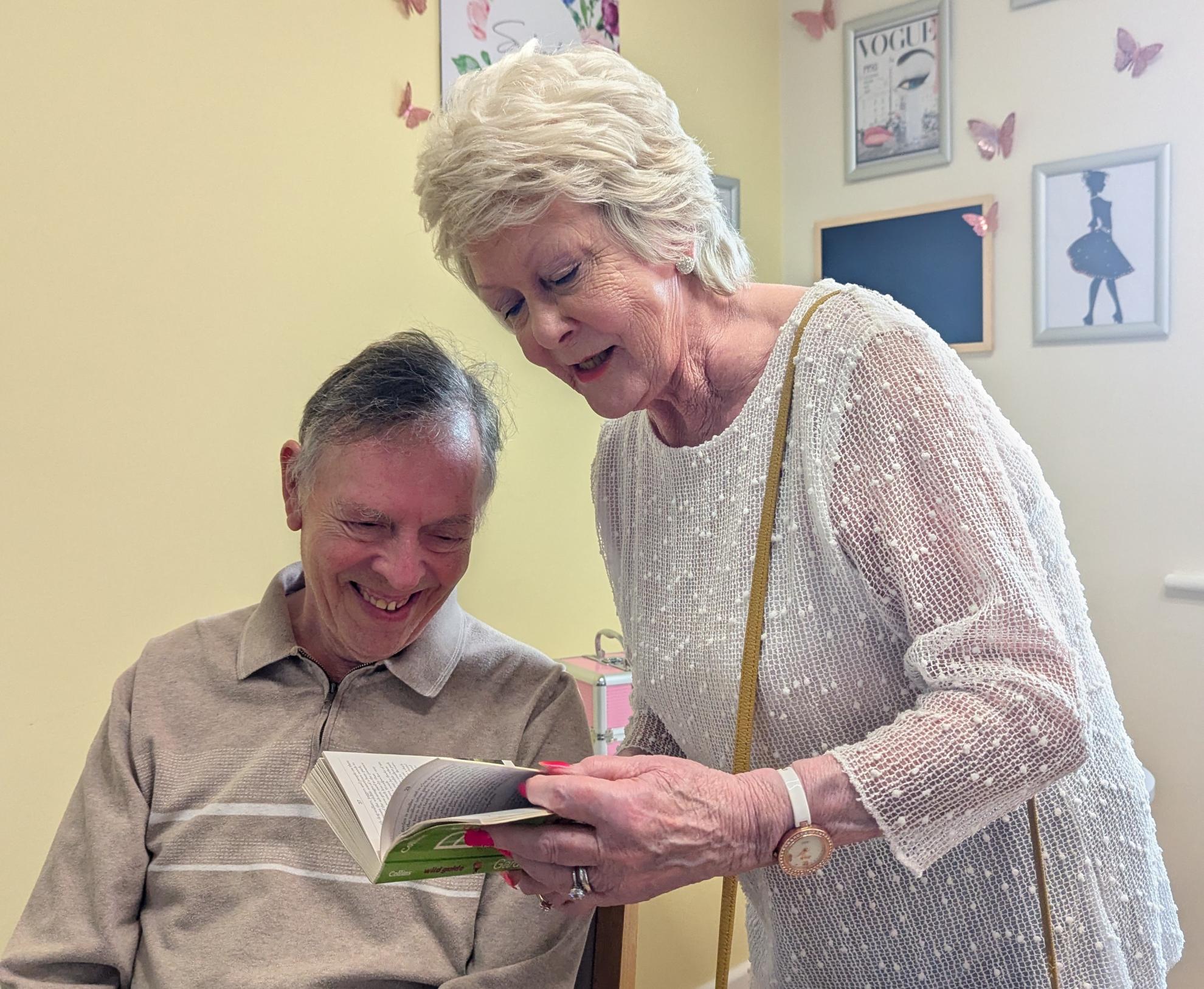Albert and Collette read book about bird-watching