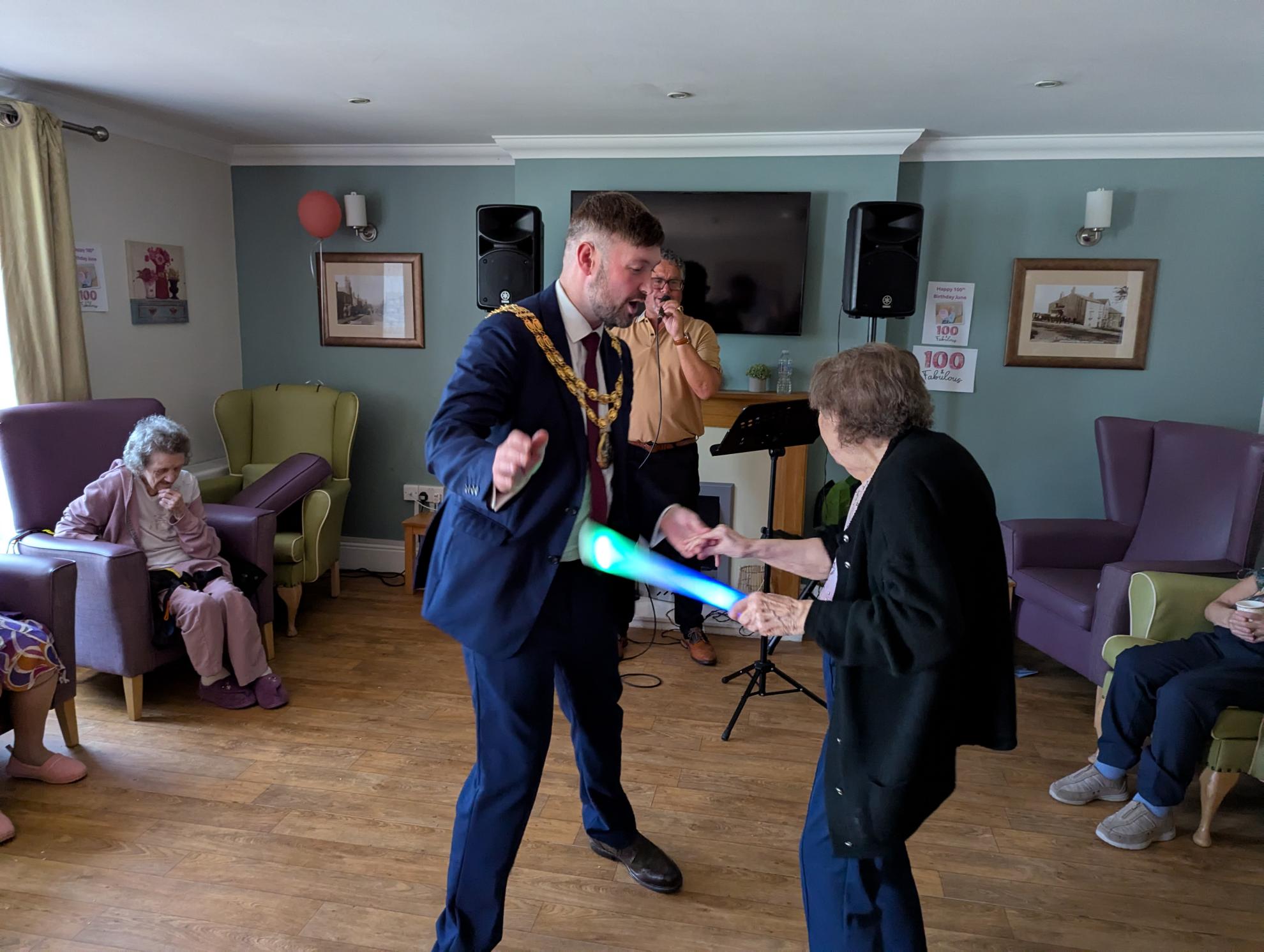 photo of resident dancing with the mayor