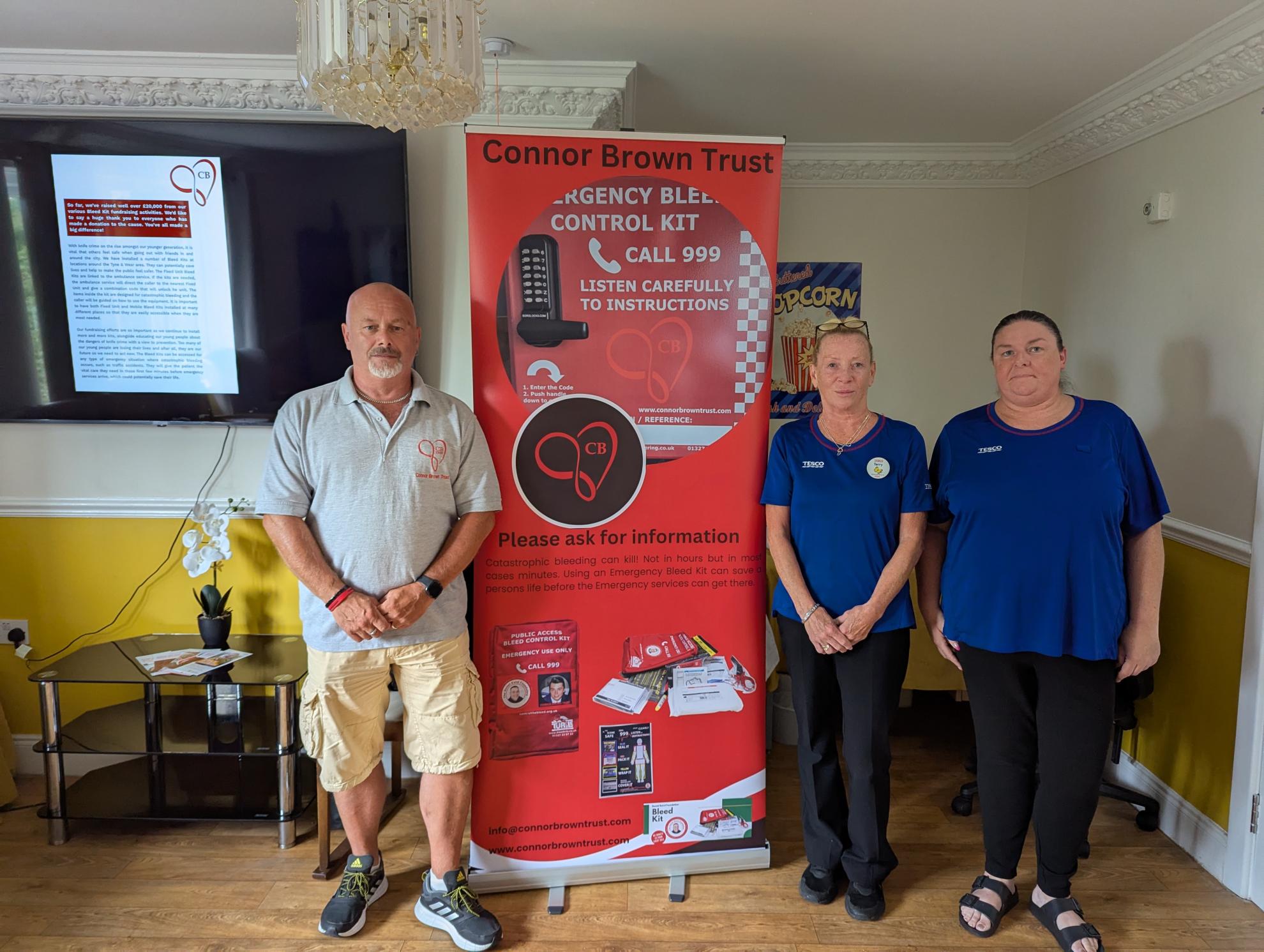 Photo of Simon with team members from Tesco