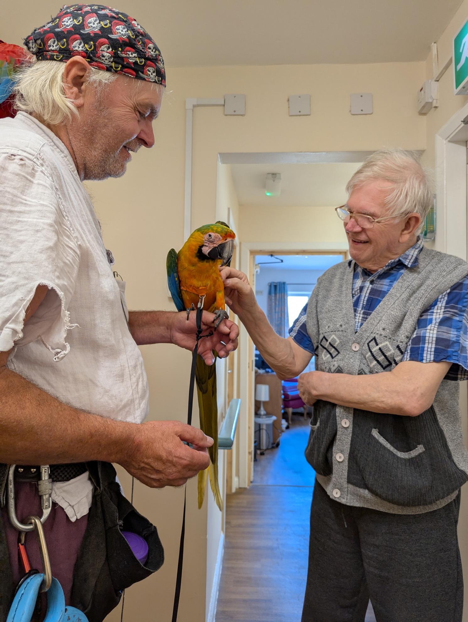 Resident at Chatsworth Lodge Care Home with a parrot 