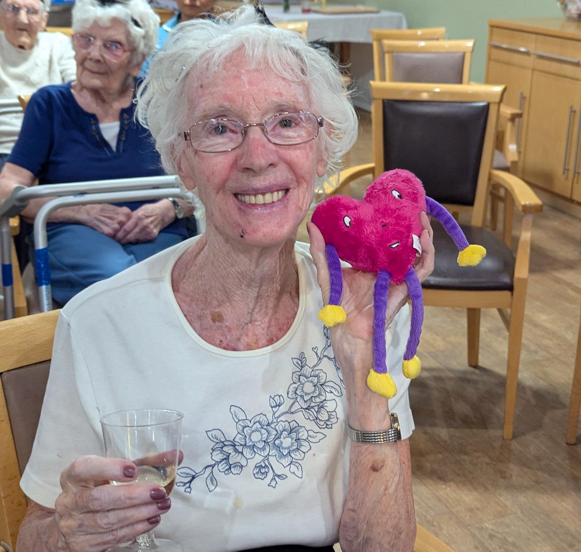 Photo of Joan with her prize teddy