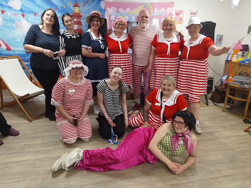 Photo of colleagues dressed in striped clothing 