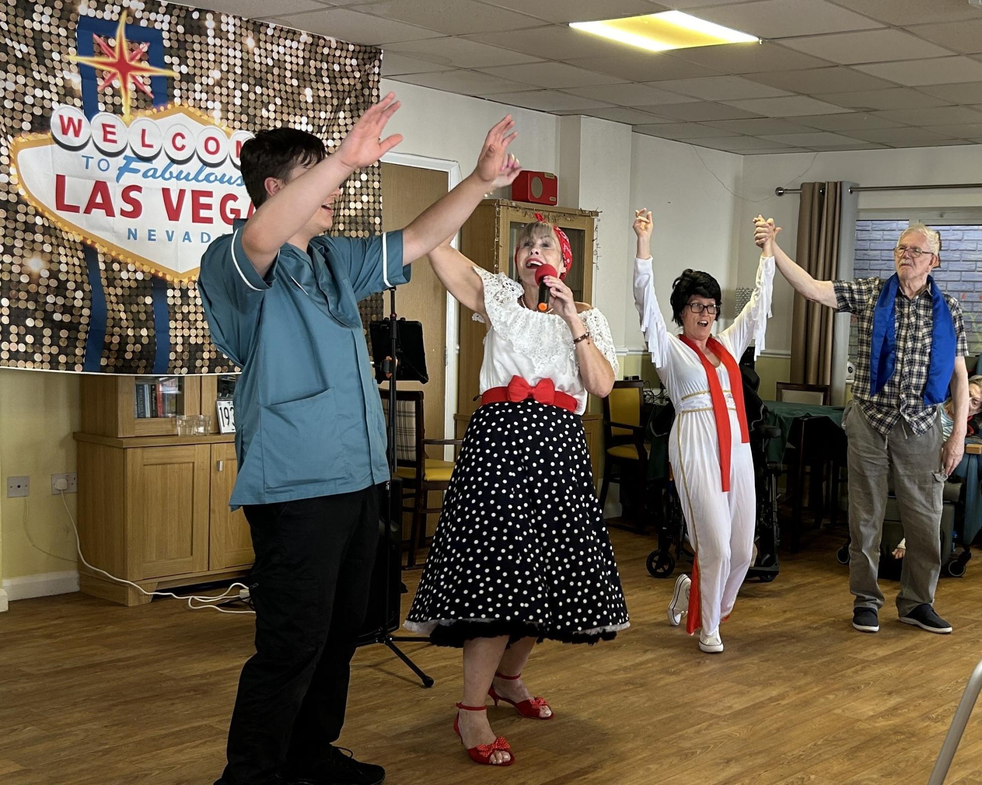 Zenka and team dancing at Elvis party