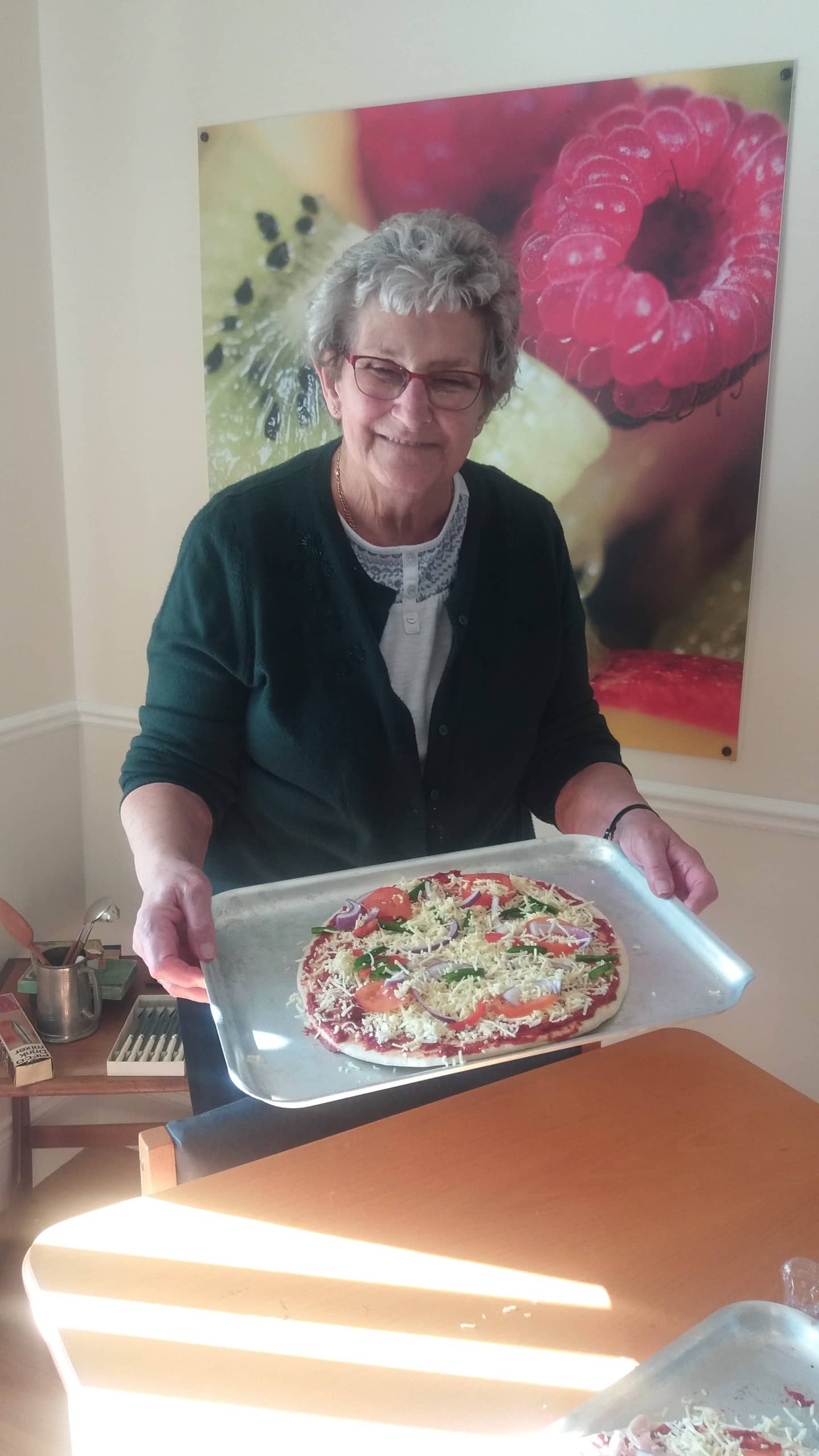 Resident ready to cook her pizza.