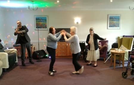 Residents Dancing to the homes live entertainment.