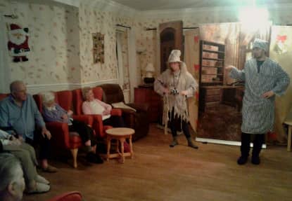 Residents all sat down, enjoying the panto.