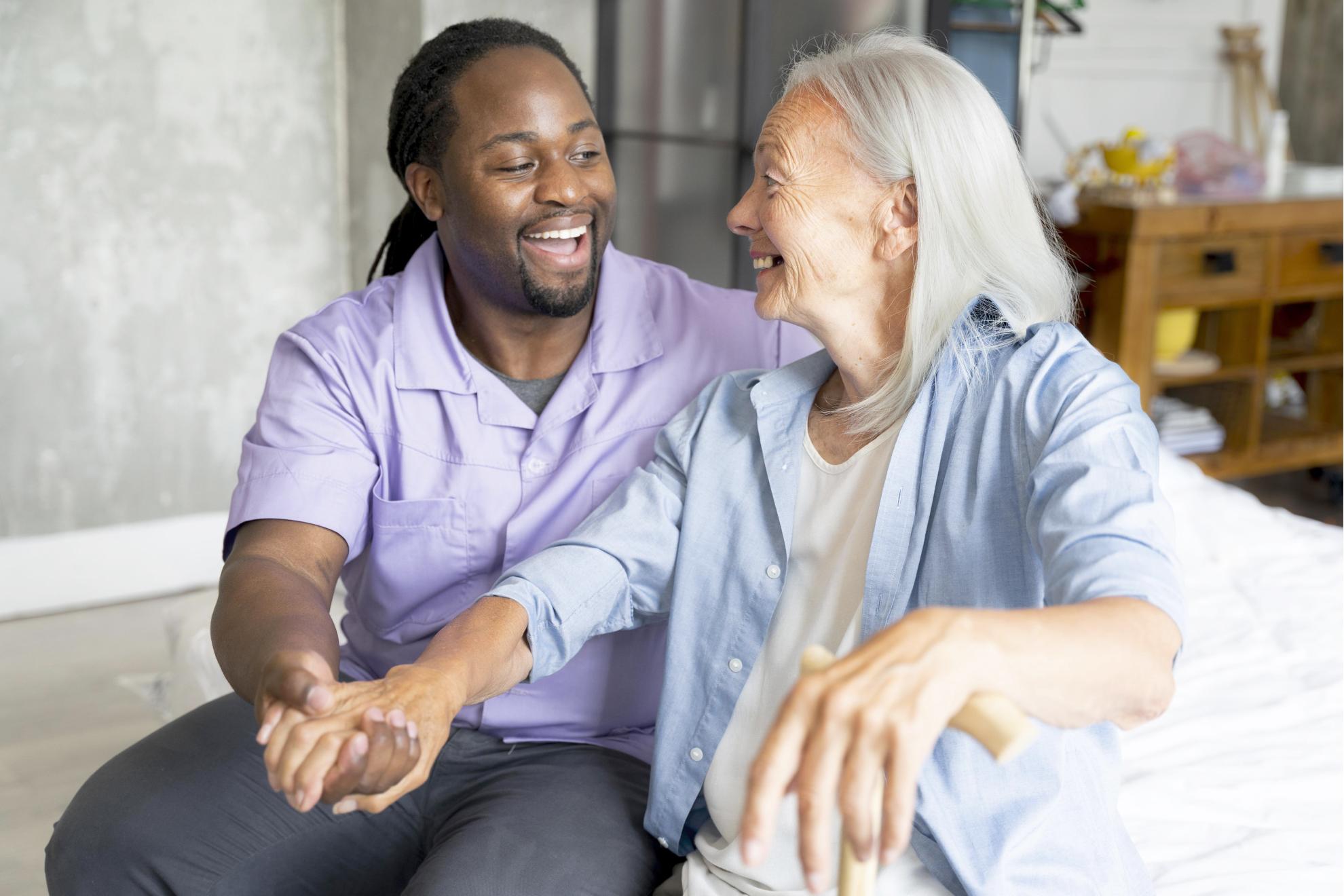Carer smiling with elderly woman