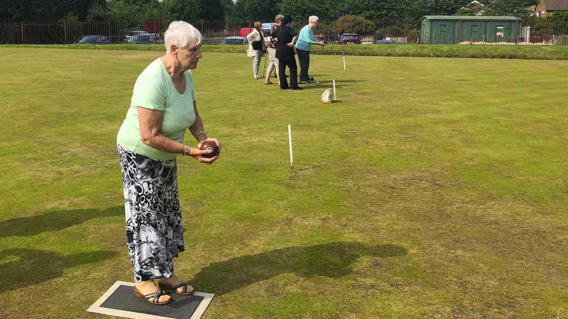 resident playing bowls