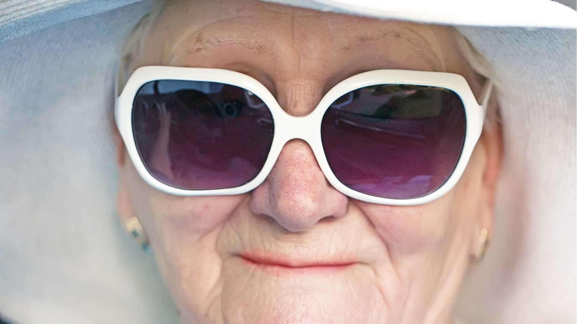 care home resident in sunglasses