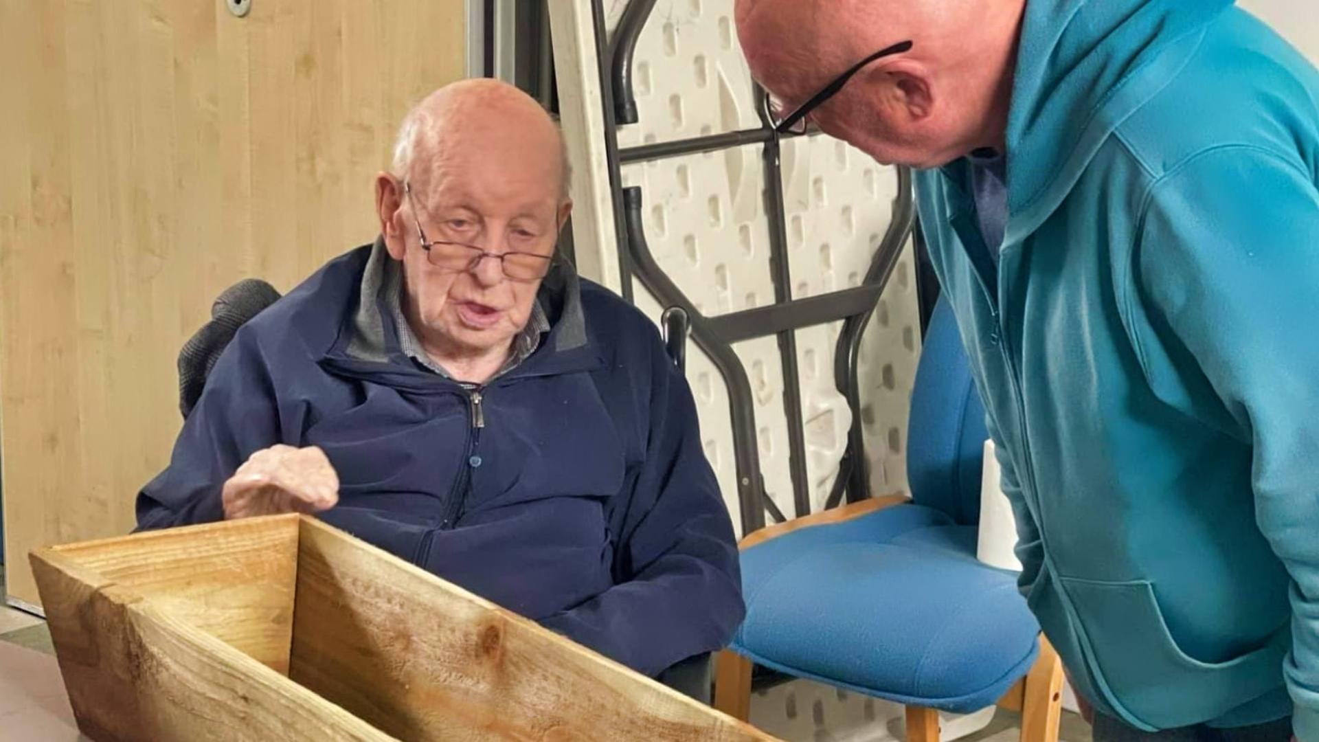 men in care home doing wood working