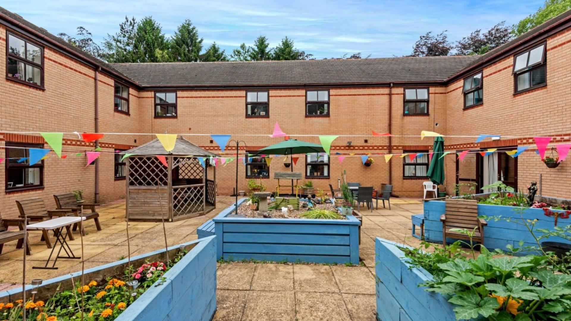 Garden with plants at Millfield Nursing Home in Bolsover 