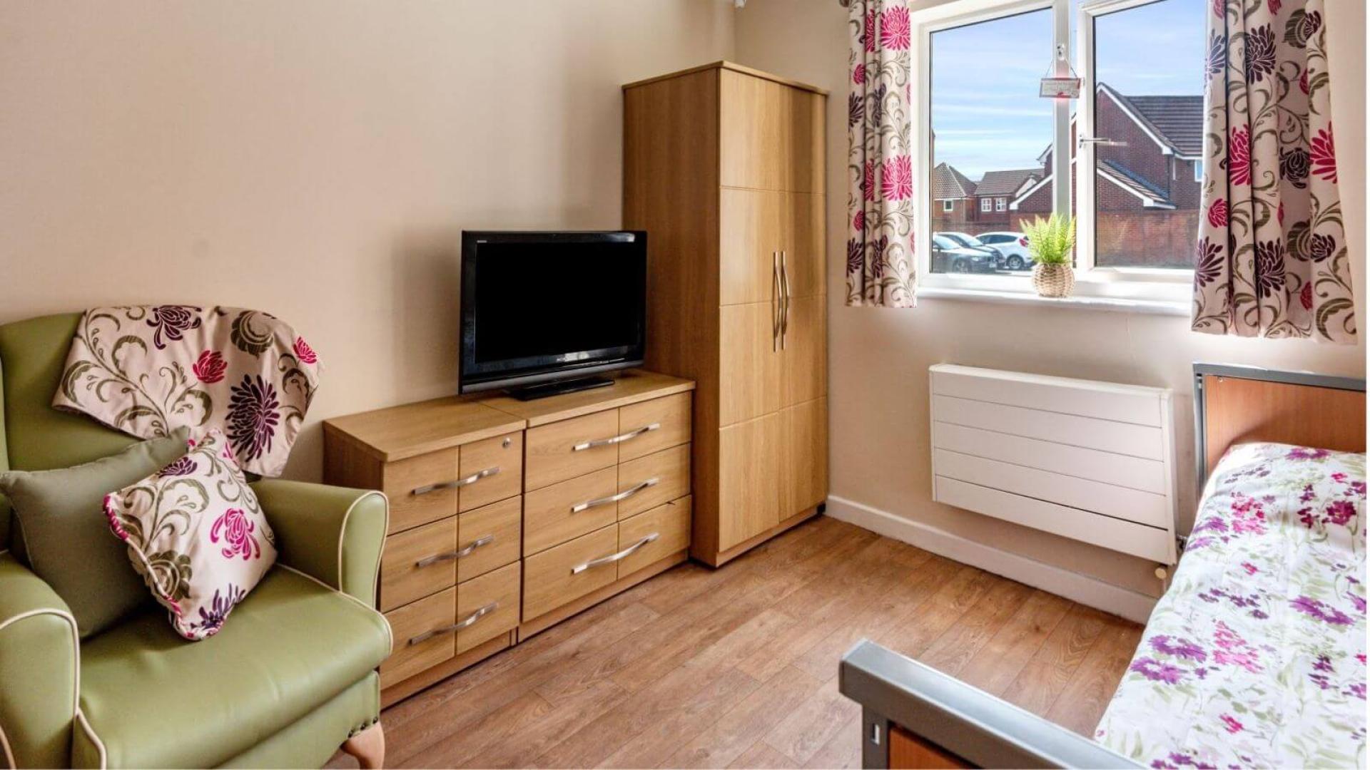Cosy bedroom at Green Park Nursing Home in Warrington