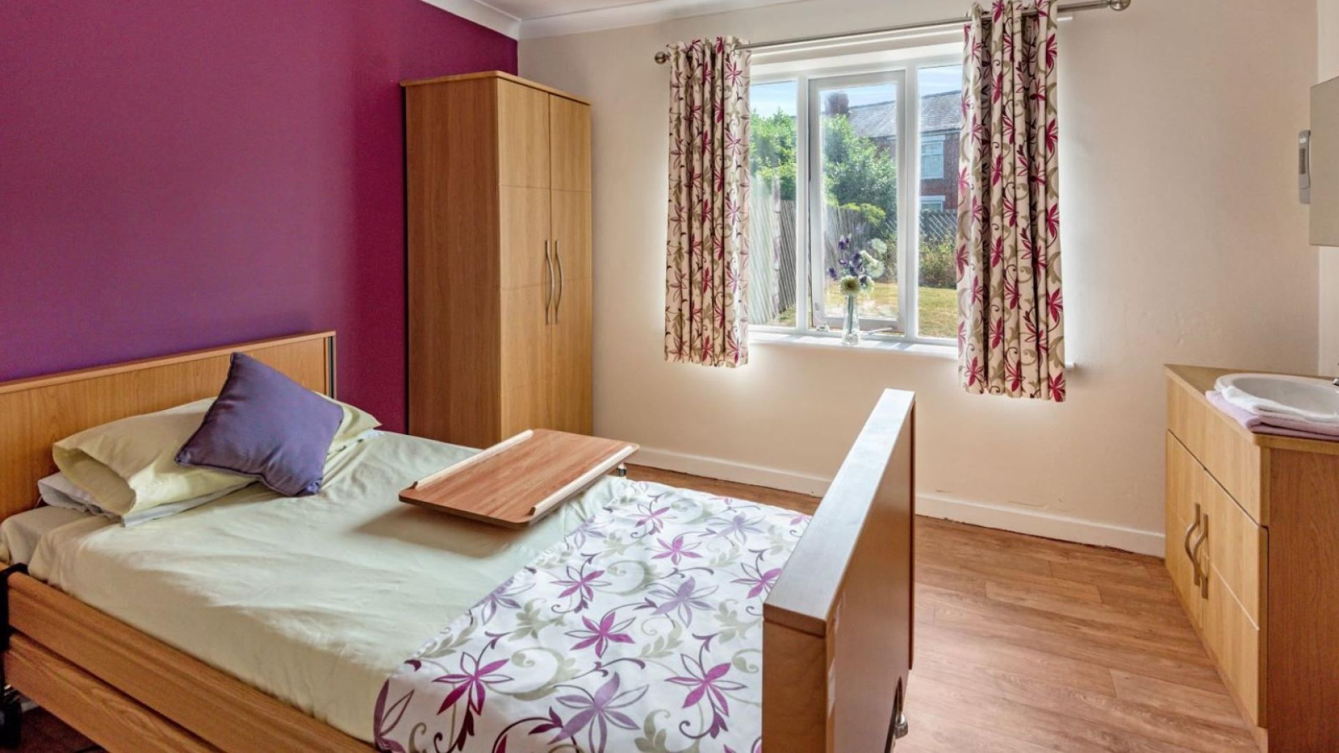 Cosy bedroom at Three Bridges Nursing Home in Warrington