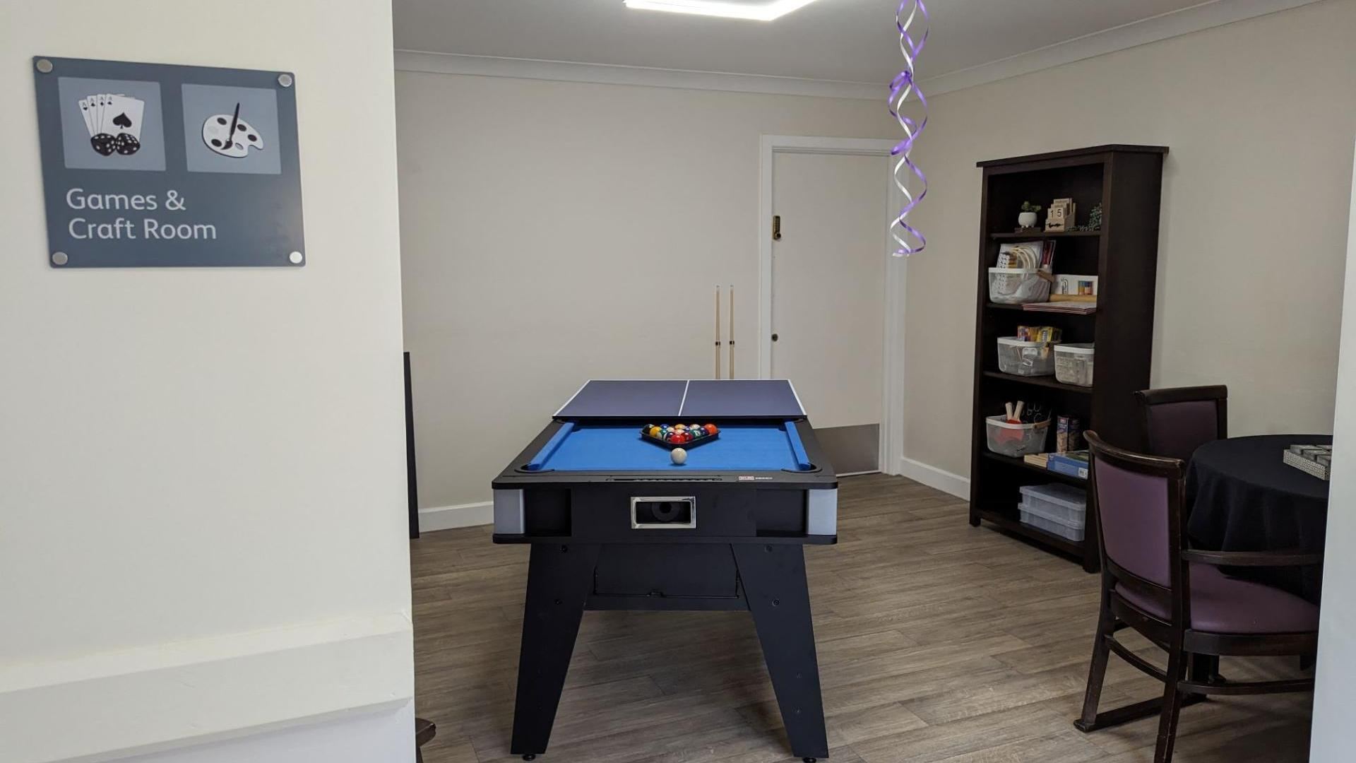 Games room in Reconnect community at Langfield Care Home in Manchester 