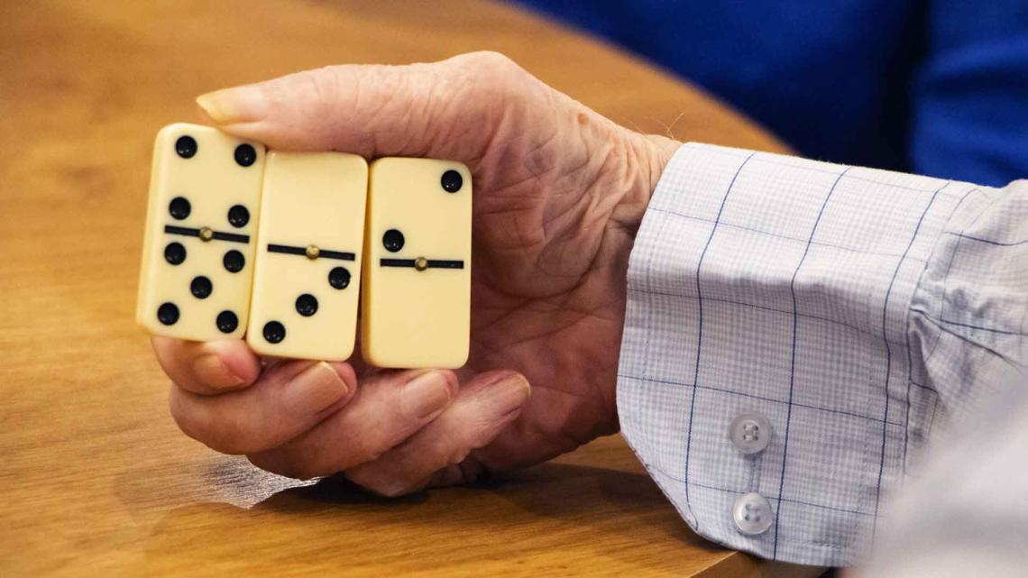 residents play dominoes