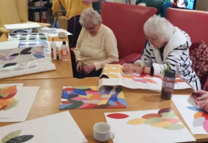 Residents using watercolours to paint some beautiful pictures.