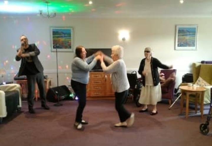 Residents Dancing to the homes live entertainment.
