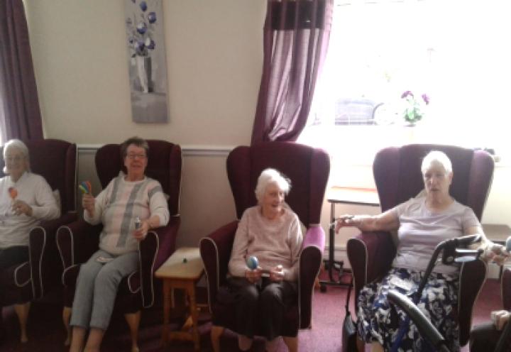 residents playing bingo with their instruments