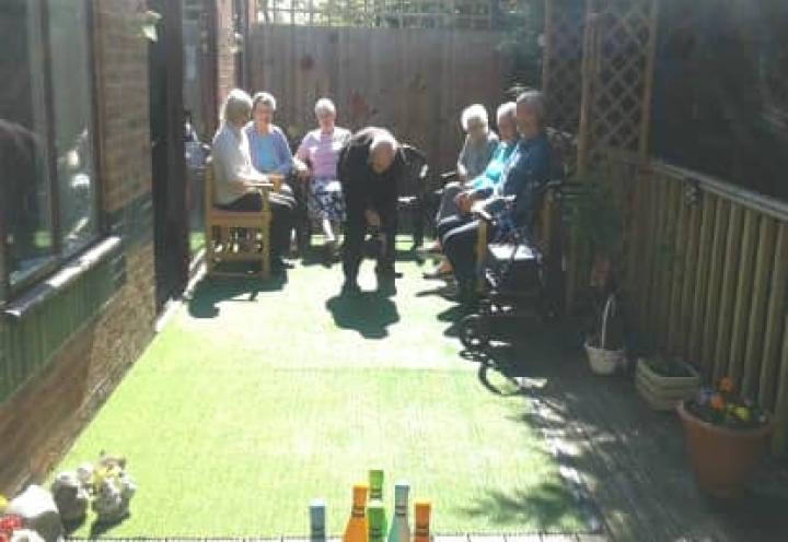 Residents bowling outdoors