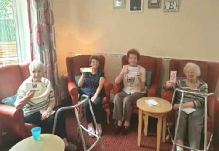 Residents showing off their cards