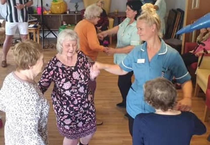 residents dancing away with the staff