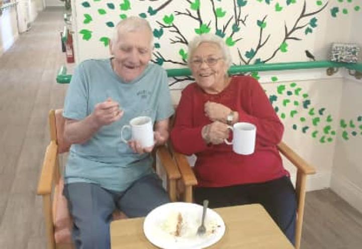 Residents enjoying a cup of tea and cake 