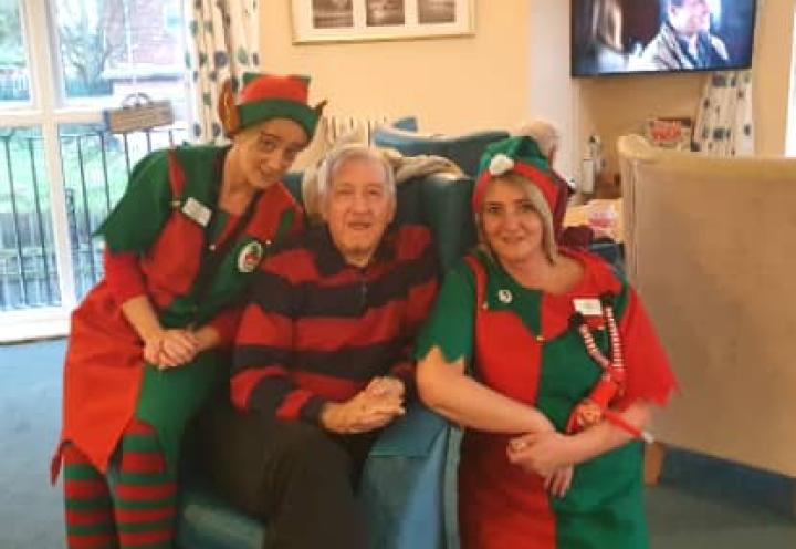 staff dressed up in elf costumes. 