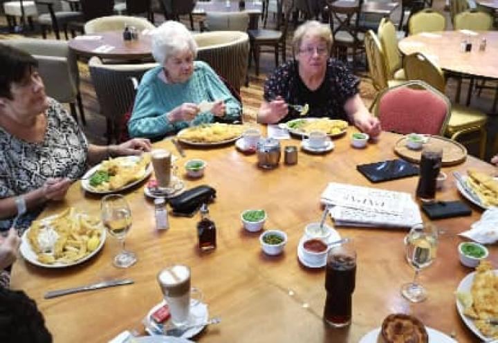 Residents enjoying their fish and chips. 