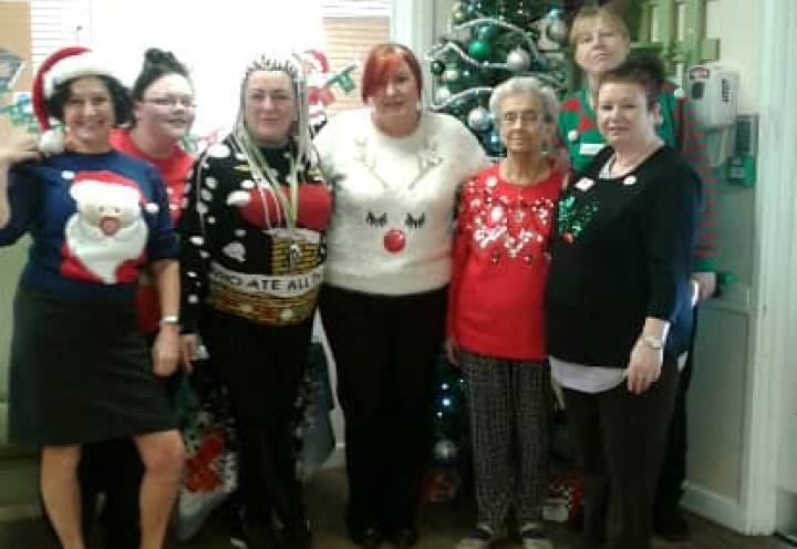 staff and residents wearing their christmas jumpers. 