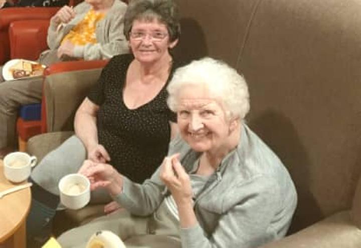 residents sat with a cup of tea enjoying the show. 