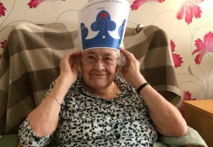 resident trying on her crown. 