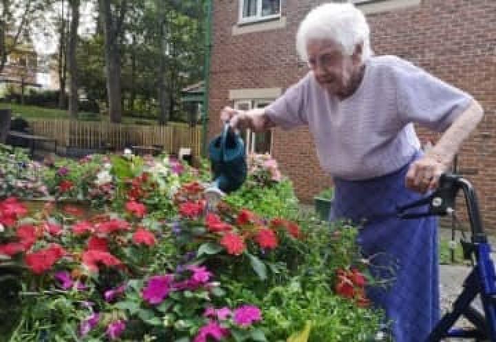 Eckington Court Care Home resident watering the flowers