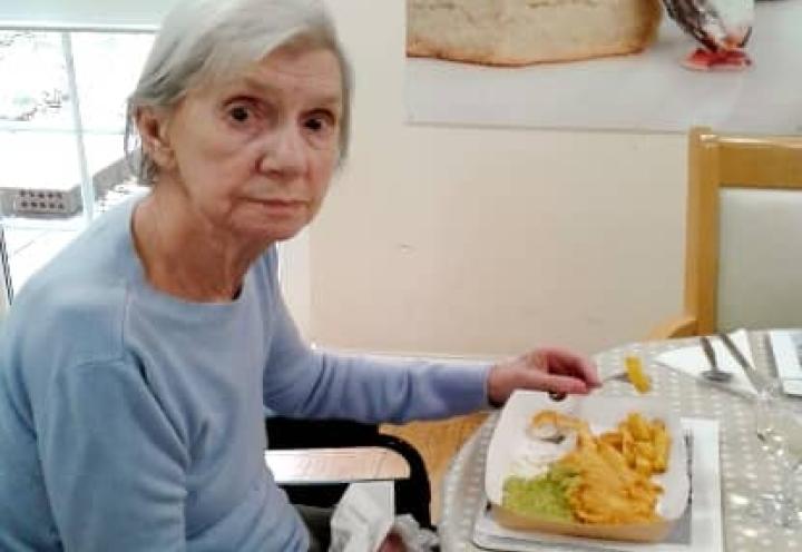 resident enjoying fish and chips. 