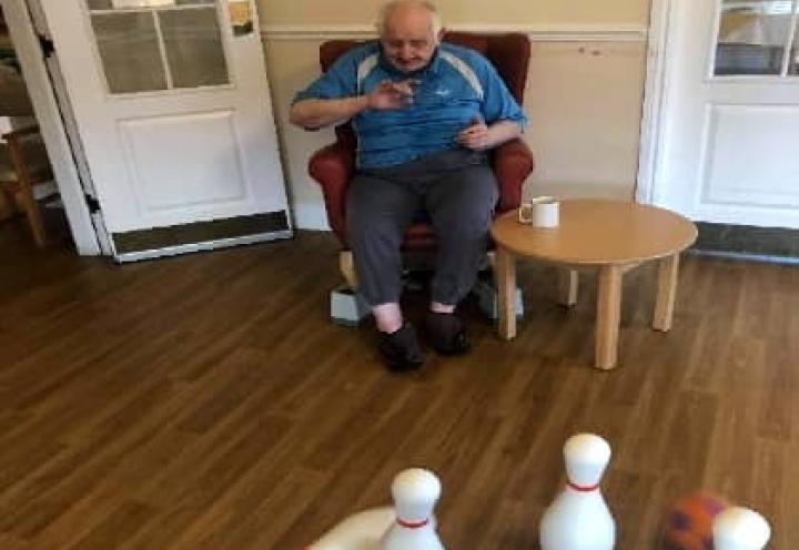 resident playing indoor skittles. 