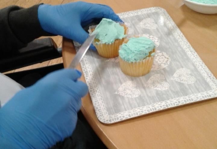 resident decorating cupcakes. 
