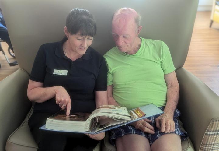 Photo of people reading a book