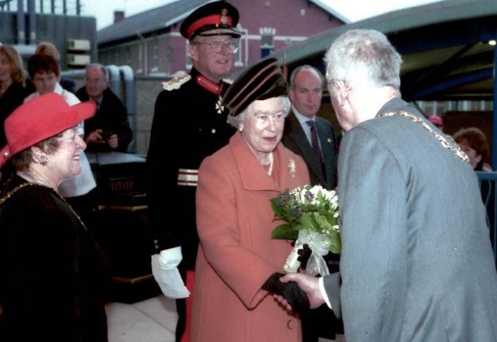 Sylvia and her husband meeting Queen Elizabeth II