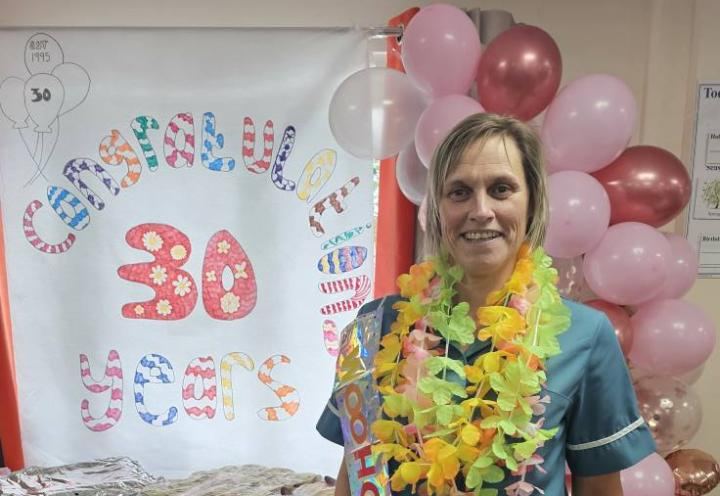 Photo of a colleague celebrating her 30th work anniversary