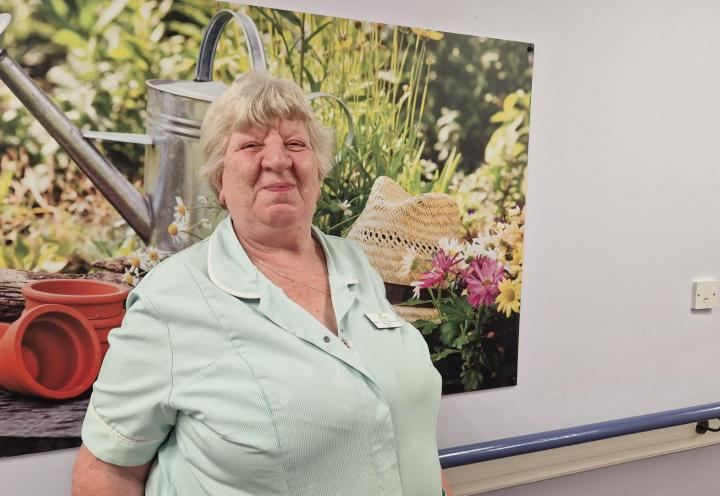 Gwen smiles proudly in Lansbury Court Care Home