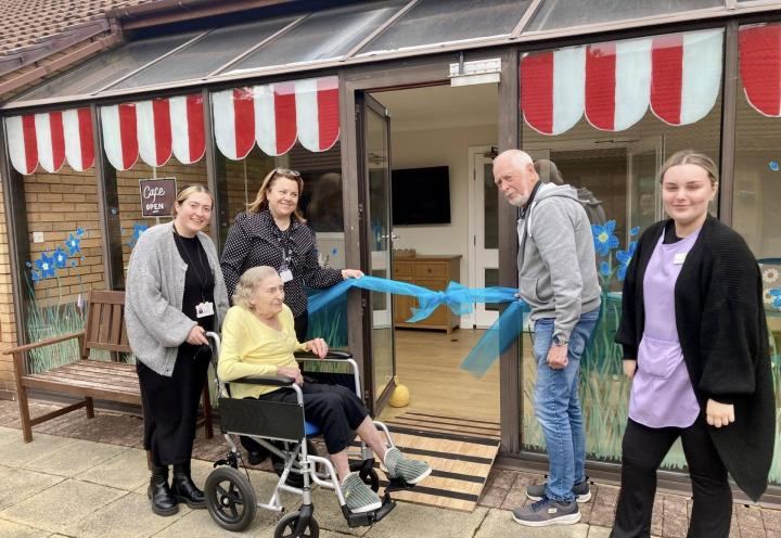 Photo of resident opening the calm cafe